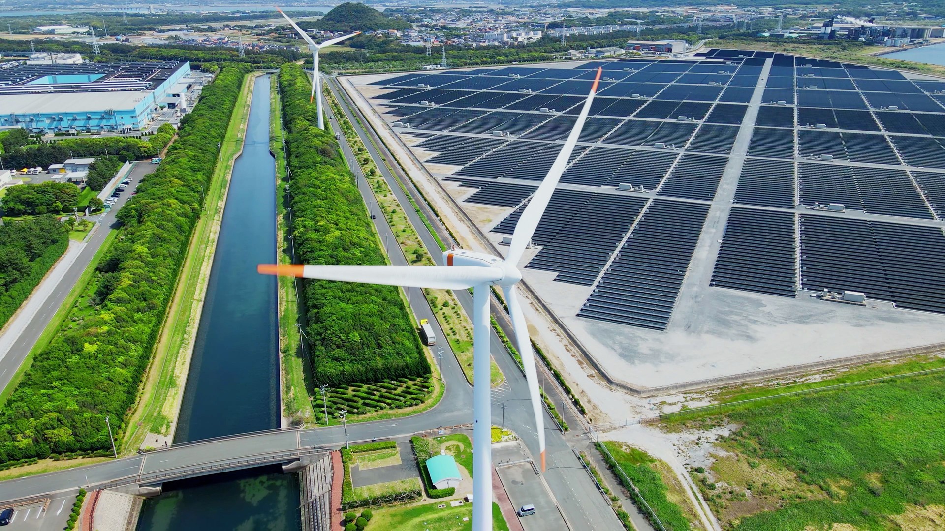 Solar power plant and Windmills aerial view. Renewable energy. Green tech.